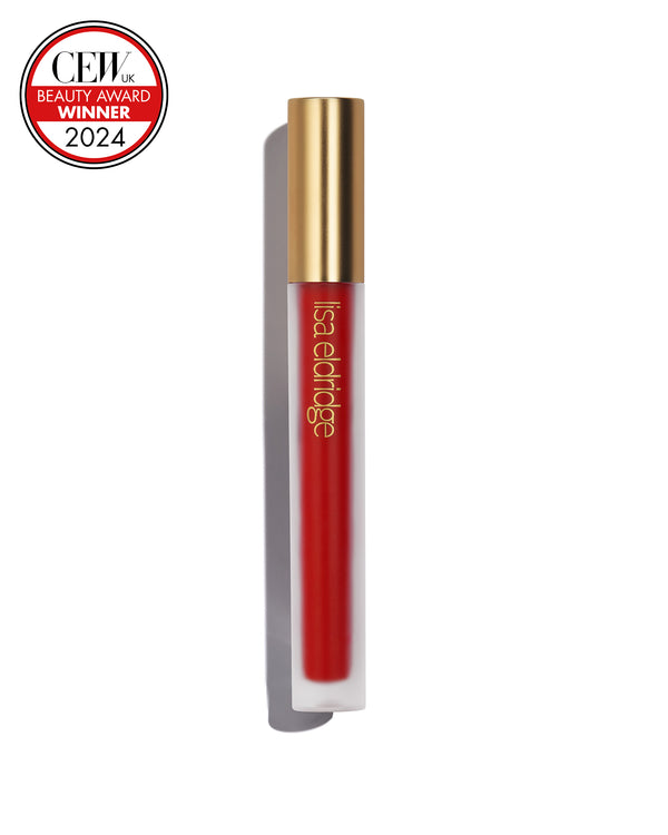 Pillar-box red liquid lip colour with gold cap on a white background, featuring a CEW Beauty Award Winner 2024 badge.