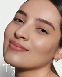 block The white pod packaging of Seamless Skin Enhancing Tint by Lisa Eldridge